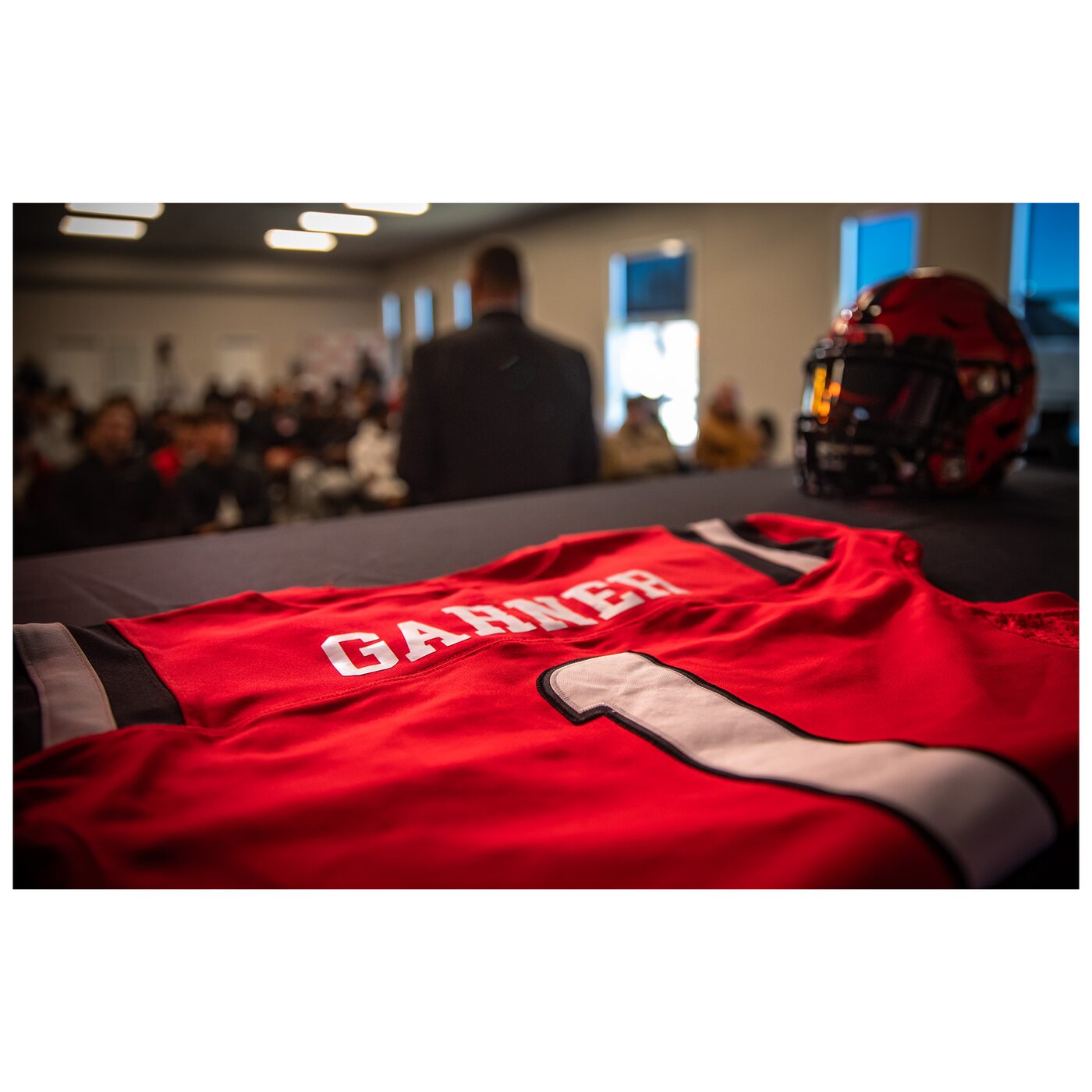 A GARNER #1 jersey laid out at a team event. The identity under the pads.