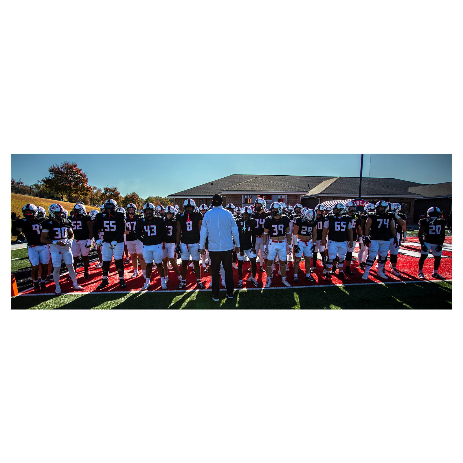 The NGU Trailblazers line up for a pre-game moment on the field.