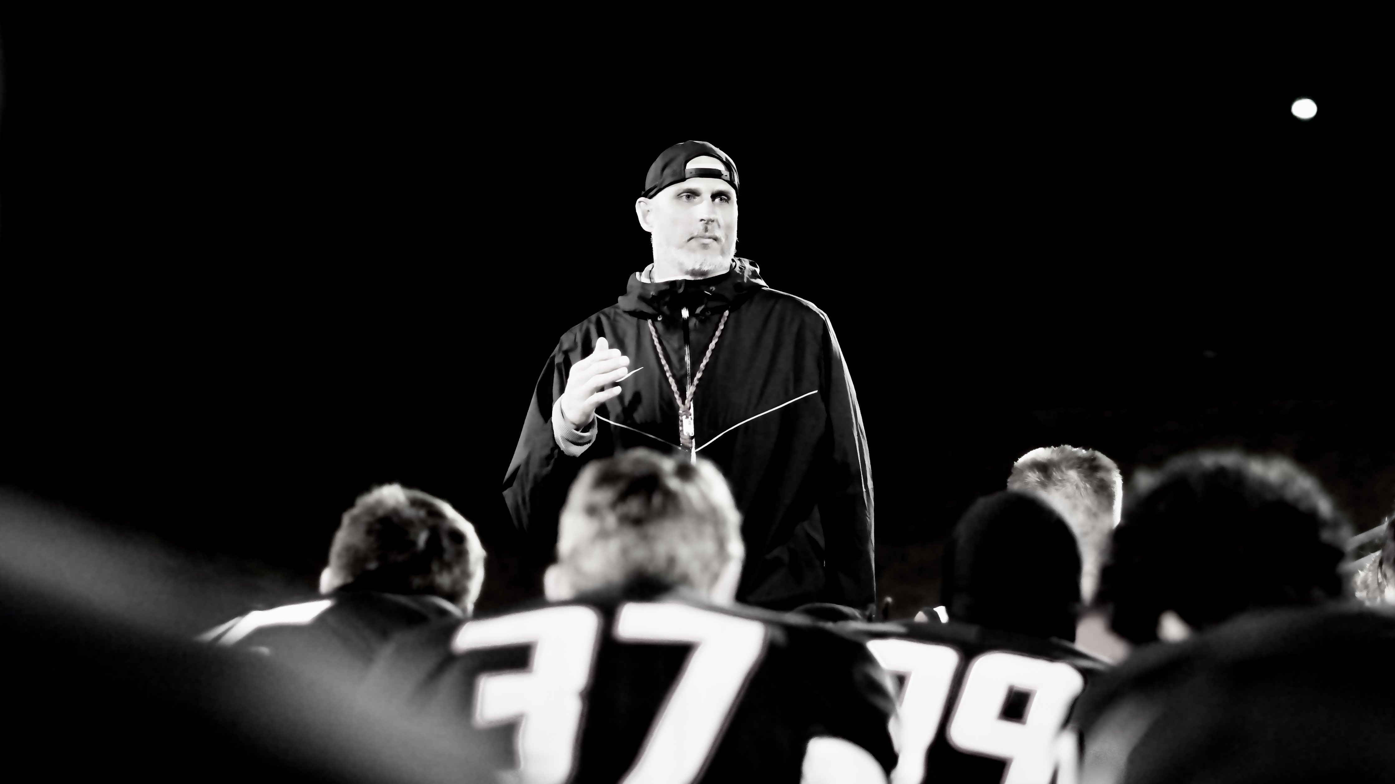 Coach Garner addressing the team at night
